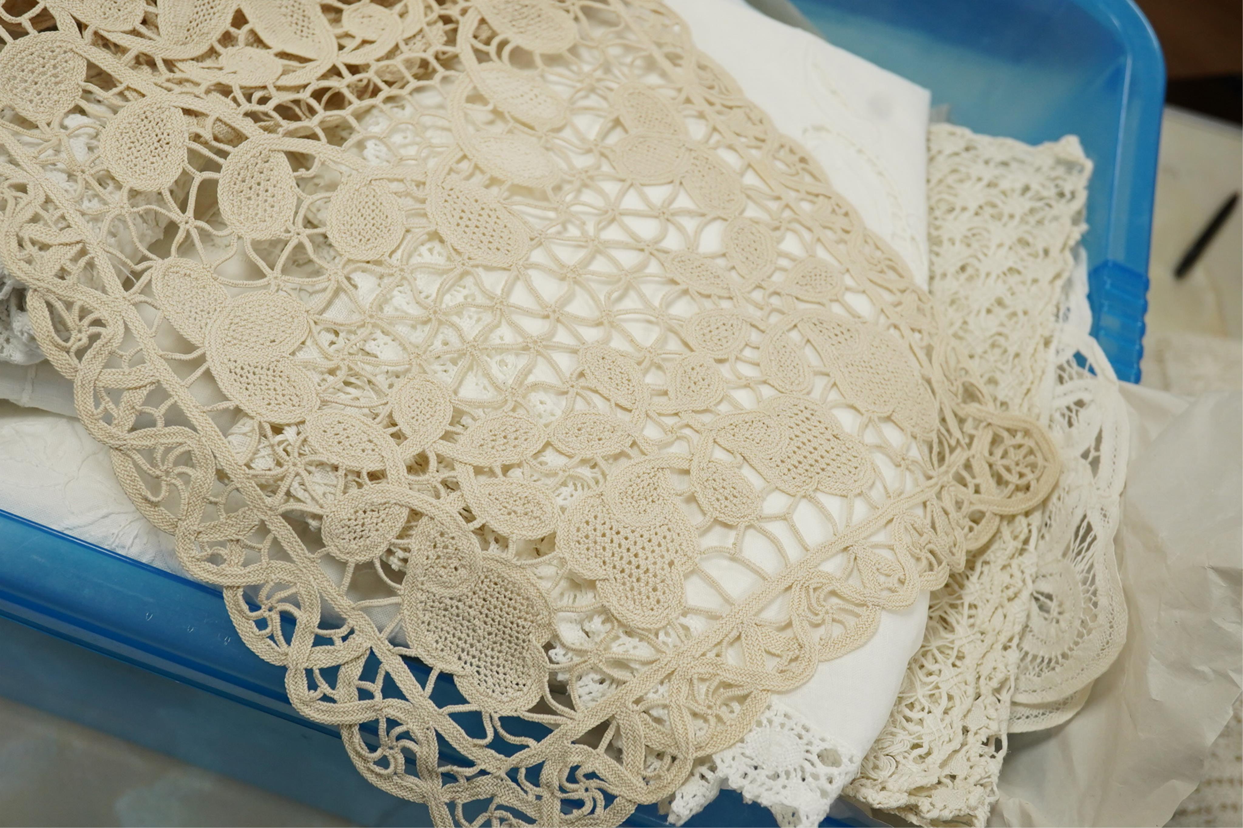 A collection of early 20th century and later crochet, cut work and drawn thread table linens and a large embroidered table cloth